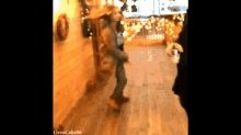 a blurred image of a woman dancing with the url orrocake96 at the bottom