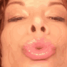 a close up of a woman 's face with a zzz written on her face
