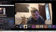 a man with a mustache is sitting in front of a computer screen that says " thug maker control "