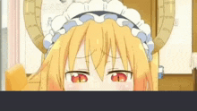 a close up of a cartoon girl with horns and a maid outfit .