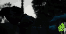 a blurred image of a person standing in the dark