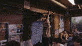 a group of people are gathered in a room with a sign on the wall that says ice