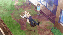 a man is laying on the ground while a girl stands behind him