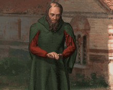 a man with a beard wears a green cape and red sleeves