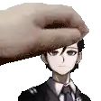 a man in a suit and tie is being pummeled by a hand .