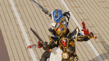 a man in a black and gold costume is holding a sword and a gun
