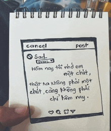 a person is holding a piece of paper with a drawing of a cell phone screen that says cancel and post