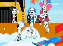 three dalmatian dogs are playing in the snow with a clown in a clown costume