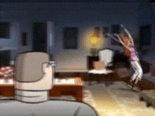 a woman is jumping in the air in a living room while a man sits in a chair .