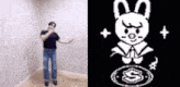 a man is dancing in a room next to a pixel art of a bunny .