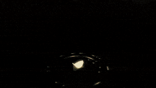 a shadow of a person is casting on a dark surface