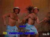two shirtless men in towels are dancing with the words maya on the screen