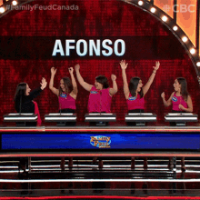 Smiling Family Feud Canada GIF - Smiling Family Feud Canada High Five GIFs