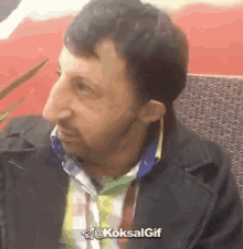 a man 's face is shown with the hashtag @koksalgif on the bottom