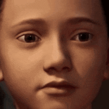 a close up of a young boy 's face making a funny face .