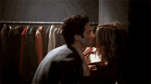 a man and a woman are standing next to each other