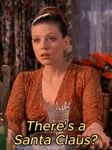 a woman sitting at a table with a glass and the words there 's a santa claus on the bottom