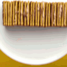 a row of crackers on a white plate