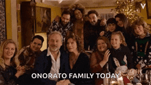 a group of people are posing for a picture and the caption says onorato family today