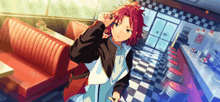 a young boy with red hair is standing in a diner talking on a cell phone .