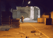 a soldier is running through a warehouse with pallets on the ground
