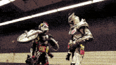 a man in a costume with a motorcycle on his back is standing next to another person