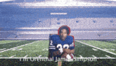 a football player with the number 22 on his jersey sits on a field