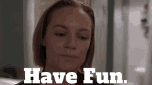 a woman 's face is shown with the words " have fun " above her