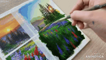 a person is painting a landscape with a brush on a piece of paper that says made in animatica