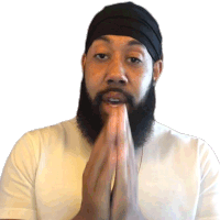 a man with a beard wearing a white shirt and a black headband is praying