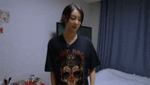 a woman is wearing a black hard rock shirt