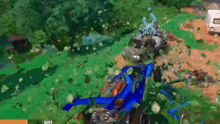 a person is playing a video game with a blue vehicle in the middle of the forest .