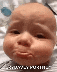 a baby is crying and making a funny face with the caption crydavey portnoy .