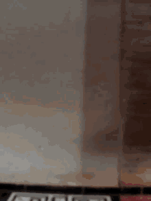 a close up of a microwave with a few spots of rust on it