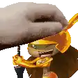 a cartoon character wearing a hat and scarf is being held by a person .