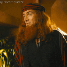 a man with long red hair and a beard is saying well he seems nice