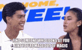 a man and a woman are looking at each other in front of a sign that says home tee !