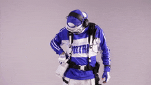 a person wearing a blue and white ultra sweater