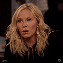 a close up of a woman 's face with the hashtag svu on the bottom