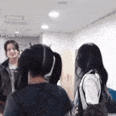 a woman with pigtails is talking to another woman with horns