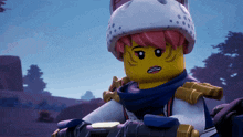 a close up of a lego character wearing a helmet with dots on it