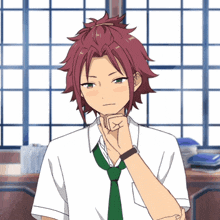 a boy with red hair is wearing a white shirt and tie