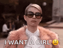a woman wearing sunglasses and a fur coat is making a sad face and saying `` i want a girl '' .