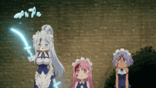 three anime characters are standing in front of a brick wall and one has a sword in her hand