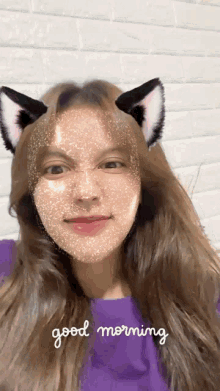 a girl with cat ears on her face and the words good morning on the bottom