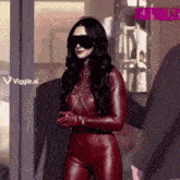 a woman in a red leather suit is standing in front of a viggle.ai sign