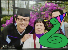 a picture of a man in a graduation cap and gown with a lenovo dual camera