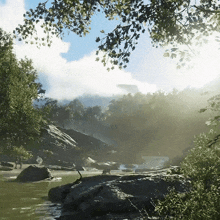 a river surrounded by trees and rocks with the sun shining through