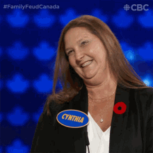 a woman with a name tag that says cynthia is smiling