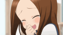 a girl with brown hair is crying and covering her face with her hand